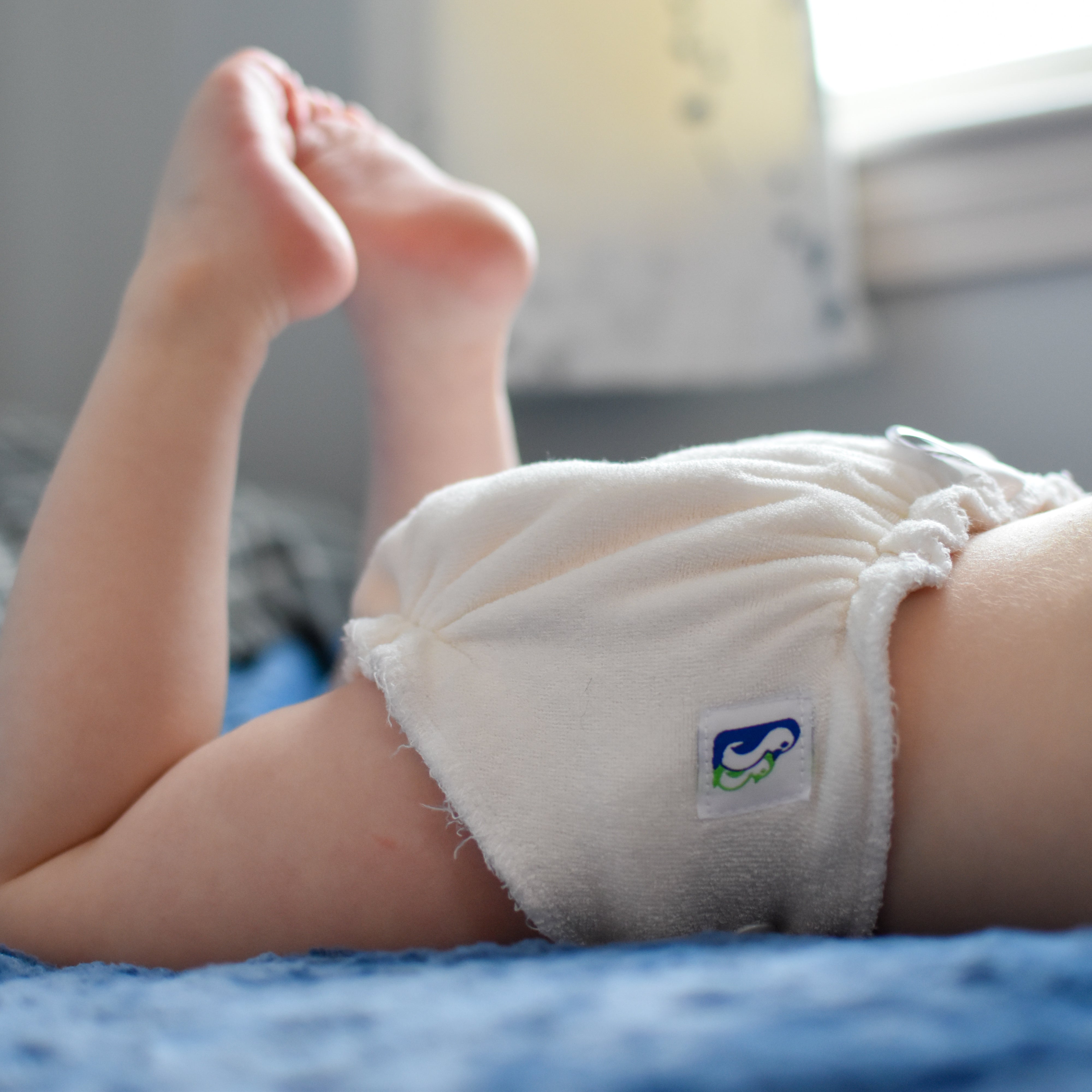 Person holding Best Bottom One Size All in Two Cloth Diaper