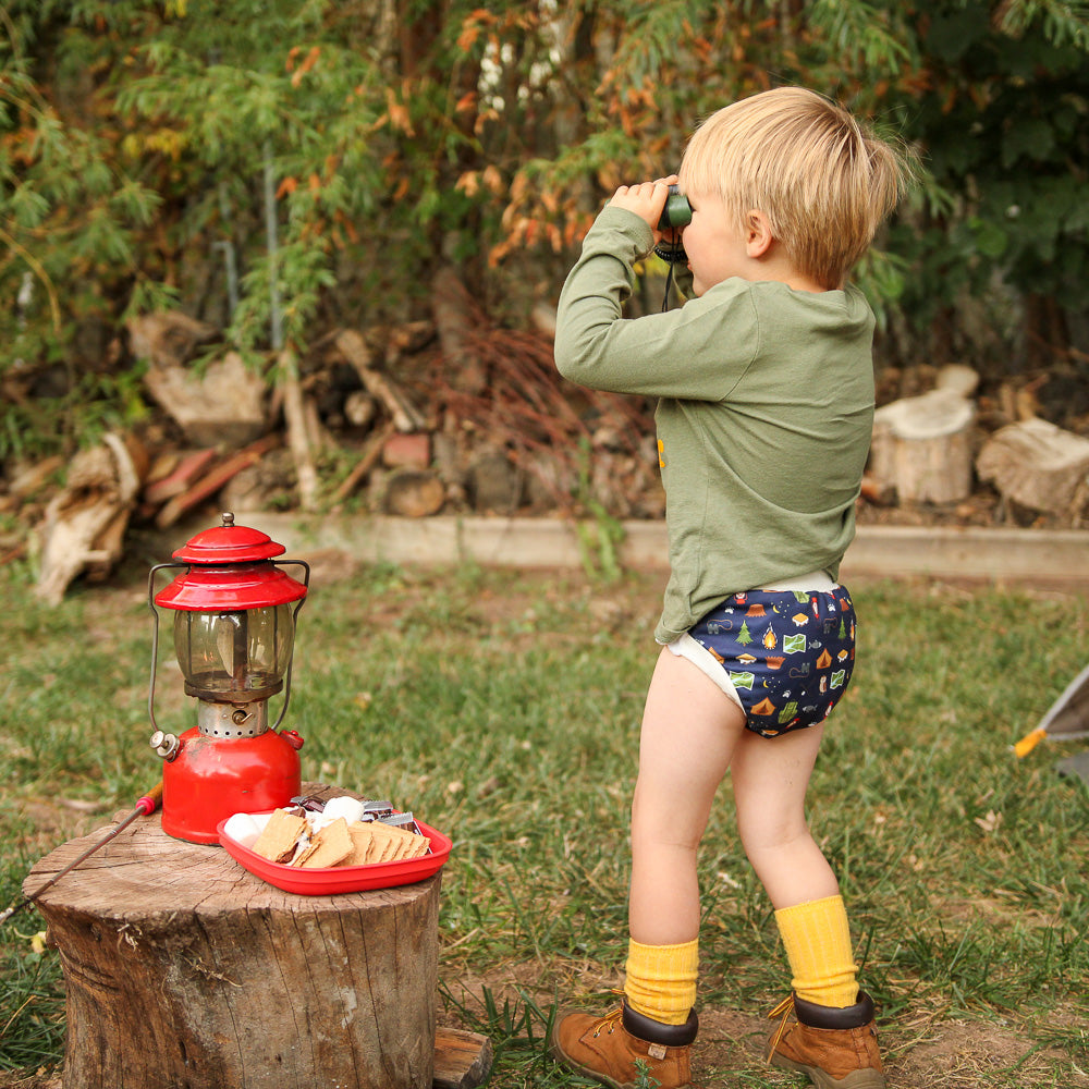 baby playing in training pants