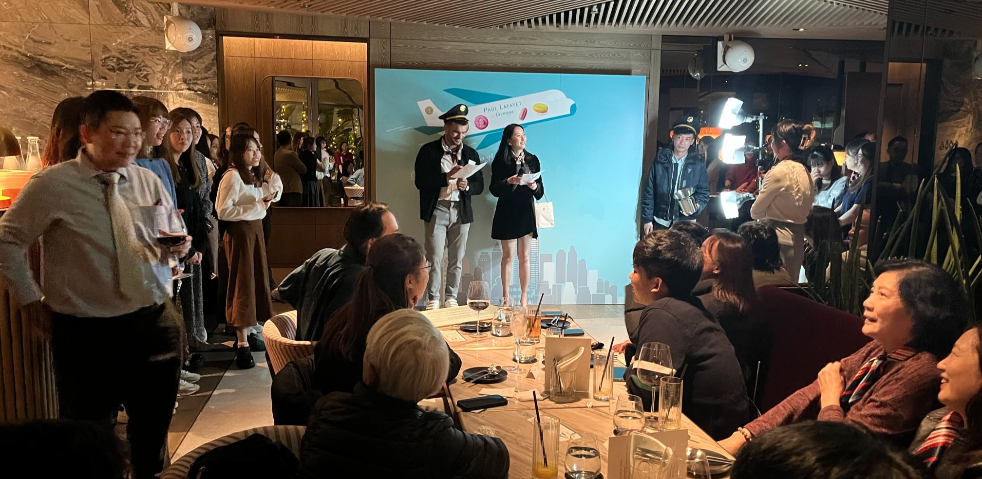 A group of staff gathering in a restaurant