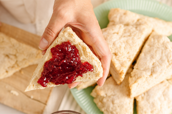 freshly baked scones with provisions jam spread on top