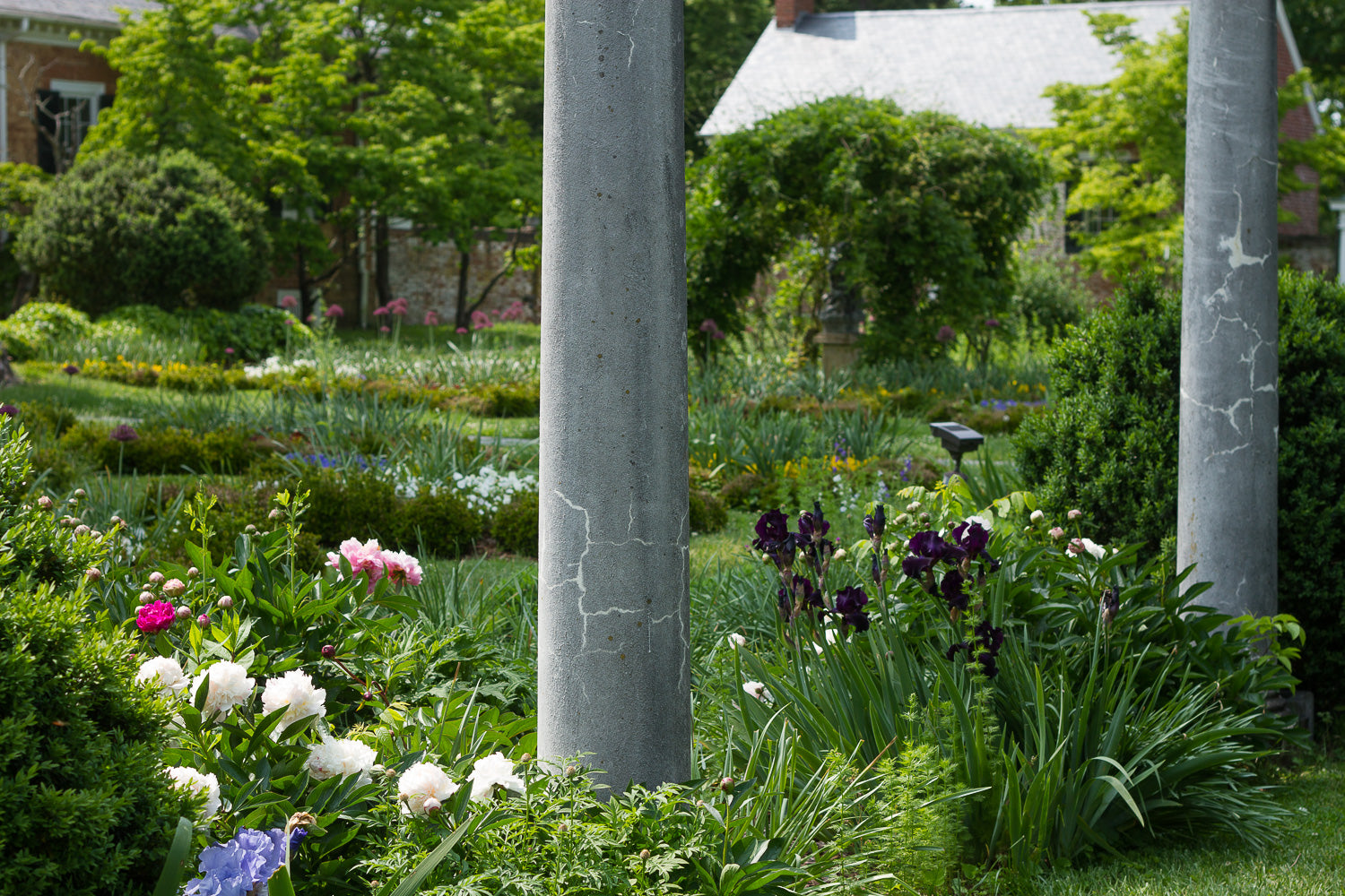 Gardens with columns and flower beds