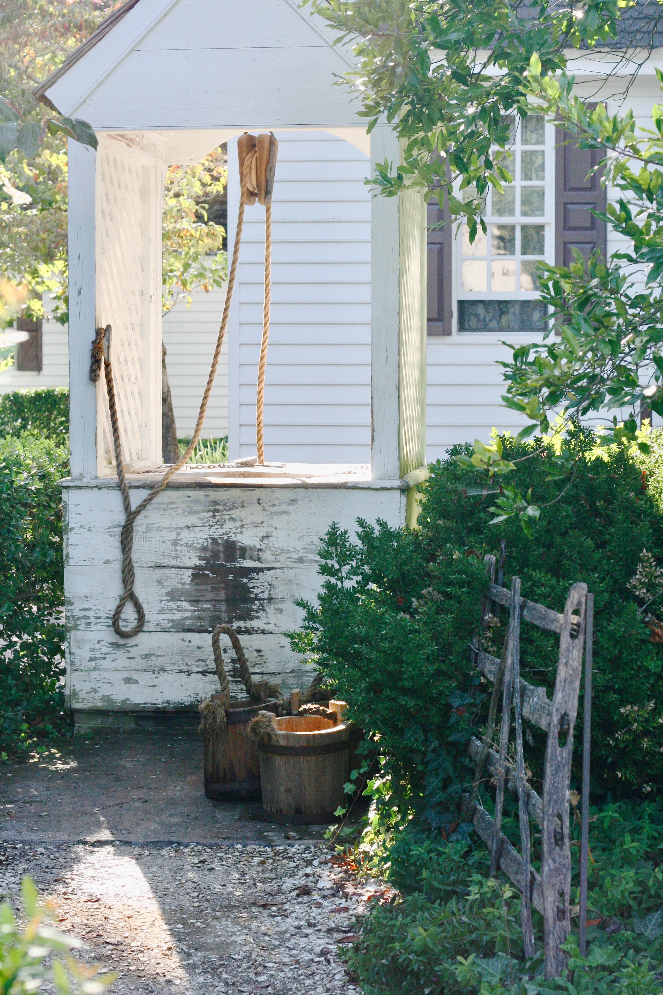 Rustic well in cottage garden