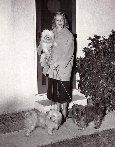 Lily Pons walking her dogs