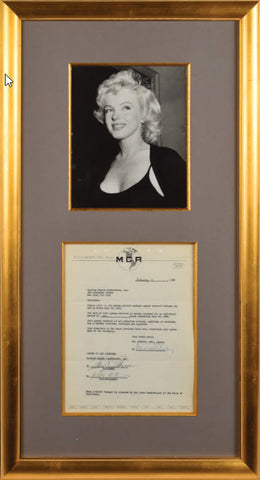 Marilyn Monroe signed contract framed with a photo