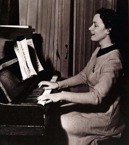 Playing the piano she won in 1928