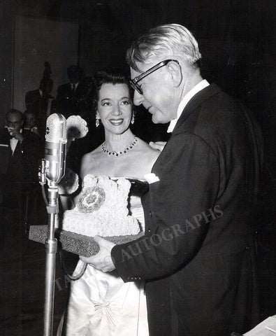 Pons is given a telephone of golden button by conductor Donald Vorhee for her 50th appearance on the Bell Telephone Hour