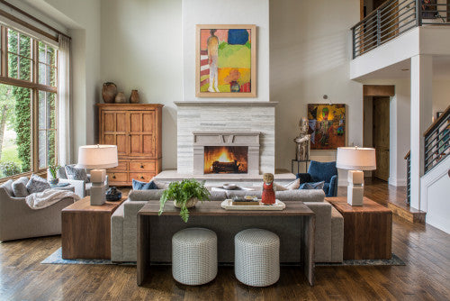 place your sofa in the middle of the living room with a console table behind it