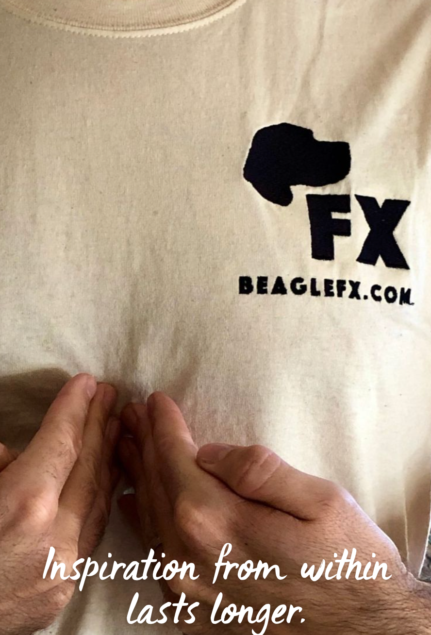 Beagle FX owner Sean in company shirt two hands pointing towards chest caption inspiration from within lasts longer