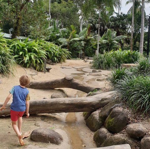 Kids LOVE to play in Nature, check out the Cairns Nature Park, where kids climb across large fallen logs, pump water into a steam, place palm fronds onto steel structures to make huts and dig to find buried treasure!