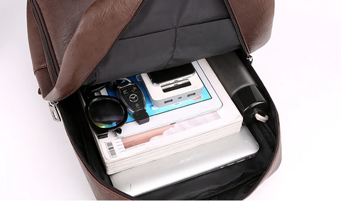backpack with laptop and books inside