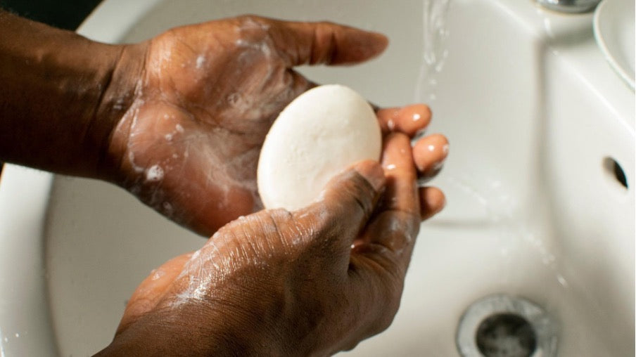 Hands holding a soap bar