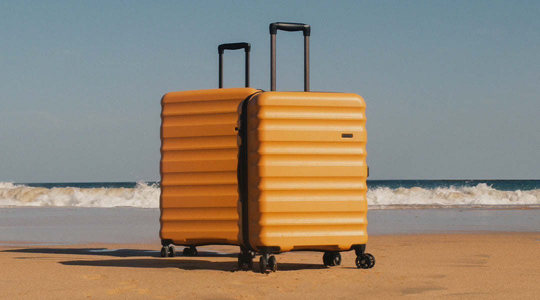 Antler hard shell suitcases in Ochre yellow