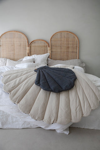 The Shell mattress on bed with rattan headboard