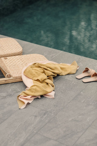 The Straw Thin Beach Towel by pool