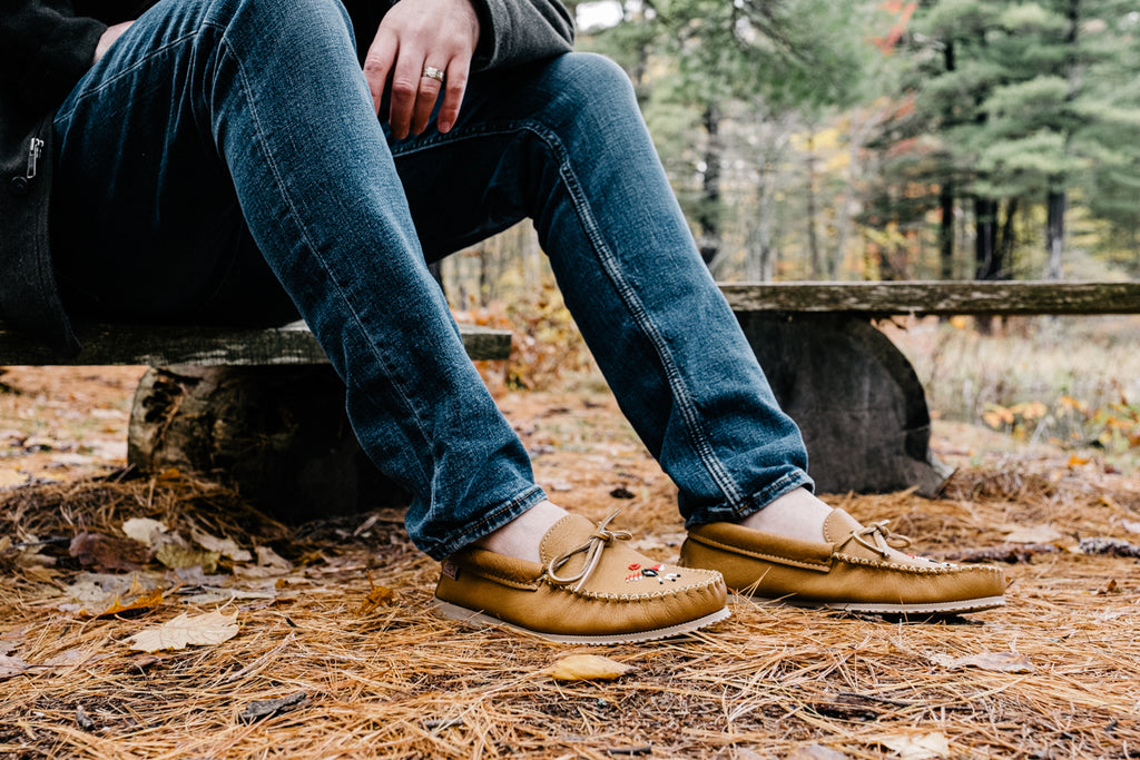 Laurentian Chief men’s handsome moccasin loafer with hand-beaded Thunderbird detailing