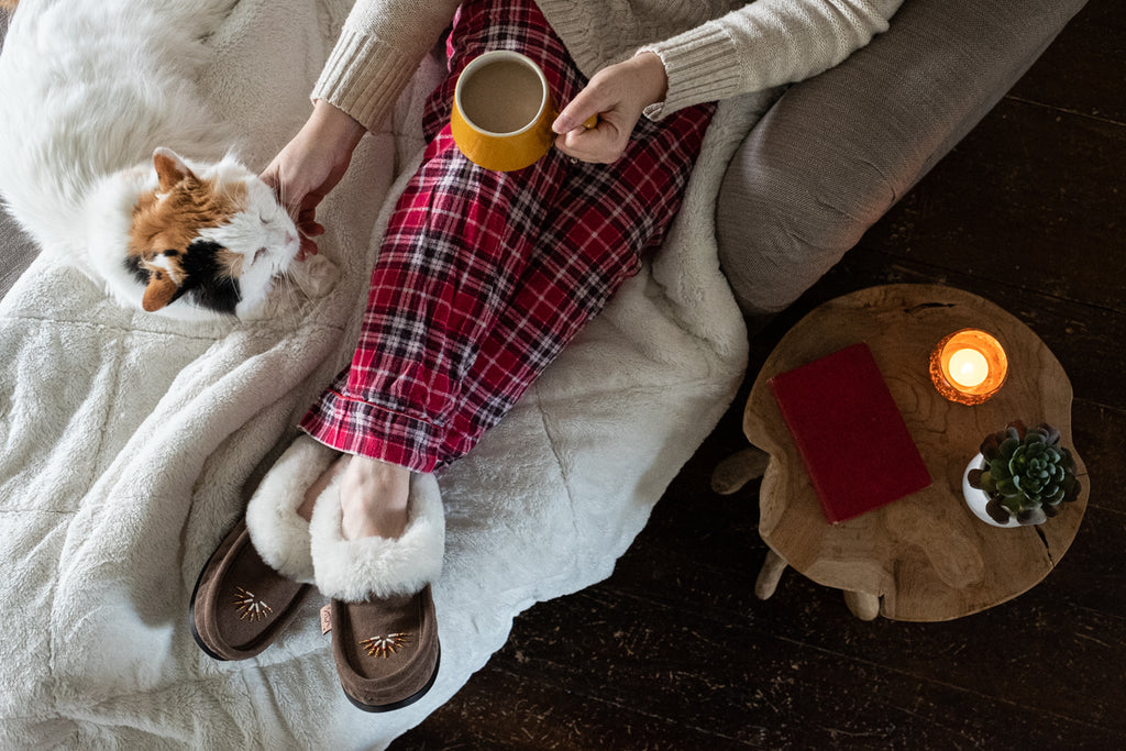 cozy winter hot cocoa and fuzzy cat and cover moccasins