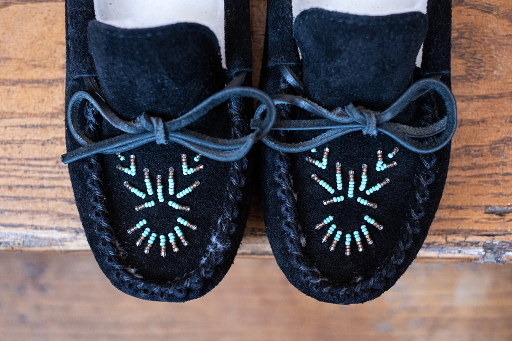 artistic hand-beaded design on a pair of authentic moccasins
