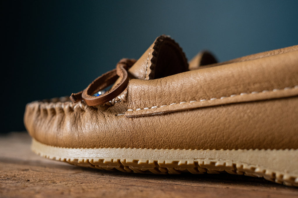 Close-up of moose hide leather and stitching on a pair of authentic Canadian-made moccasins