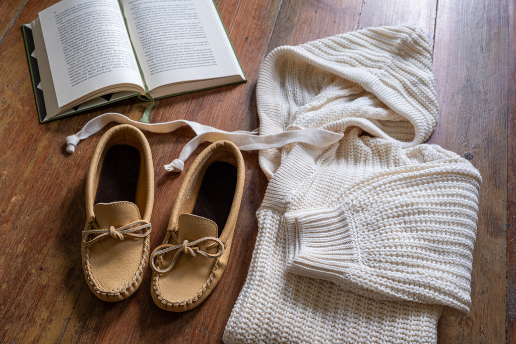 casual outfit laid out on the floor with comfortable leather moccasins