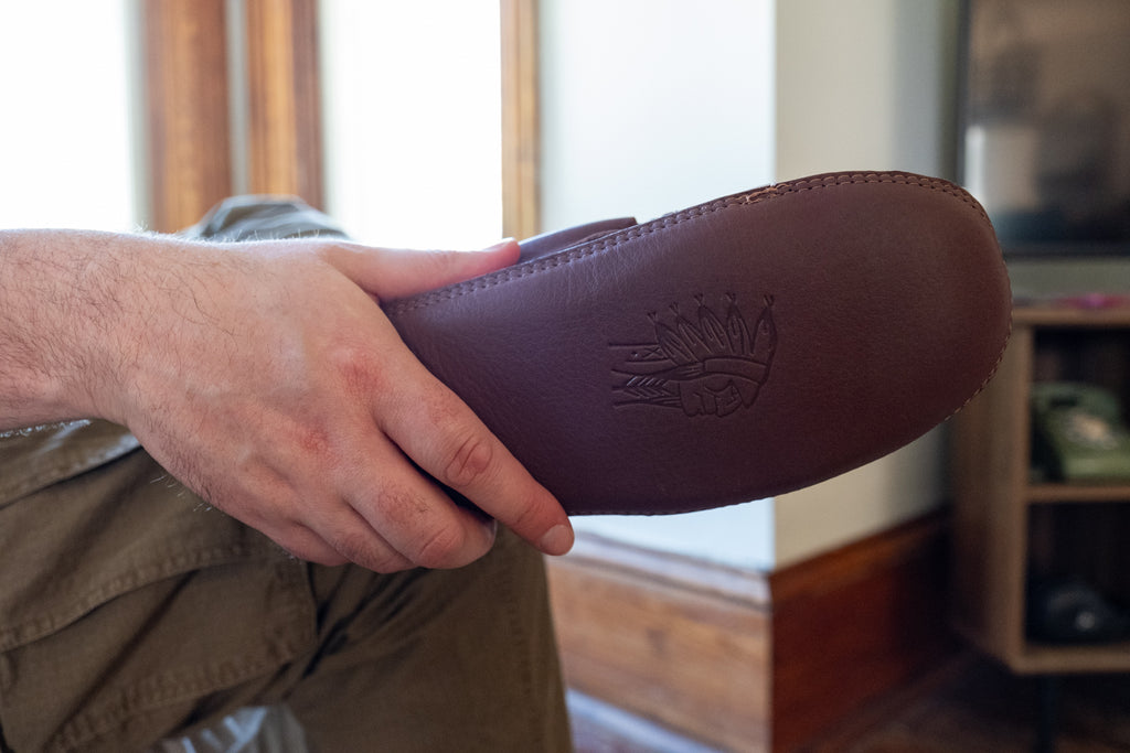 Laurentian Chief’s woodstain soft-soled indoor moccasins are made with the finest cowhide leather tanned in a deep brown as rich as stained mahogany