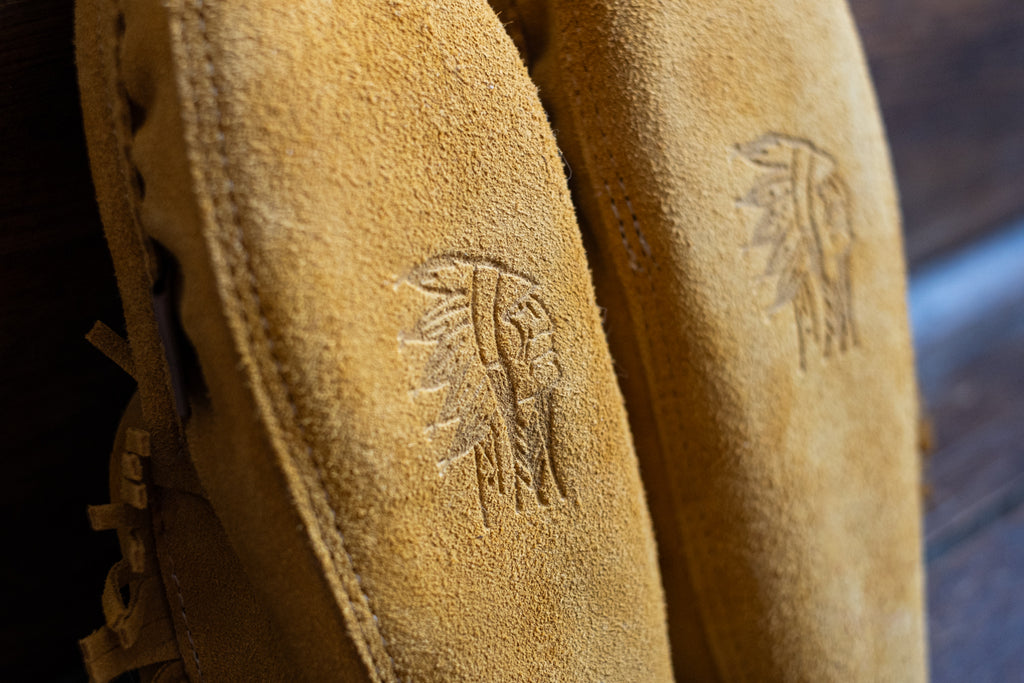 Embossed on the suede outsoles of these moccasins is the stunning Laurentian Chief logo