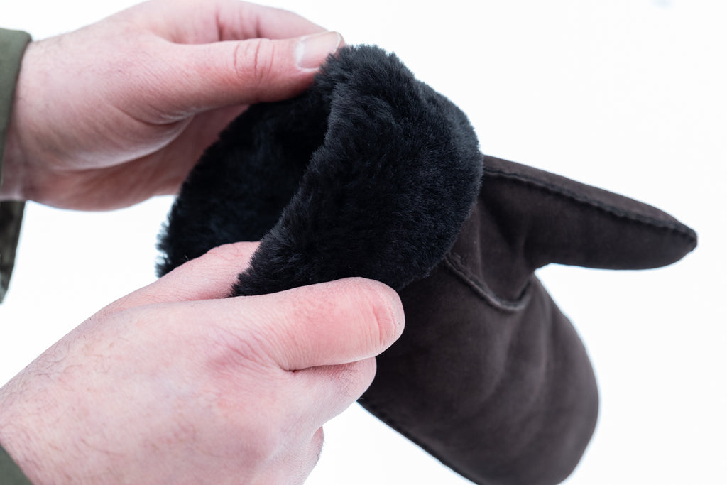 Warm sheepskin mittens with fold over collar in a dark brown color