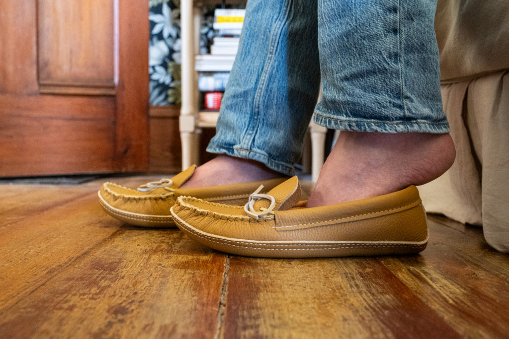 slipping on a pair of quality genuine leather moccasin slippers