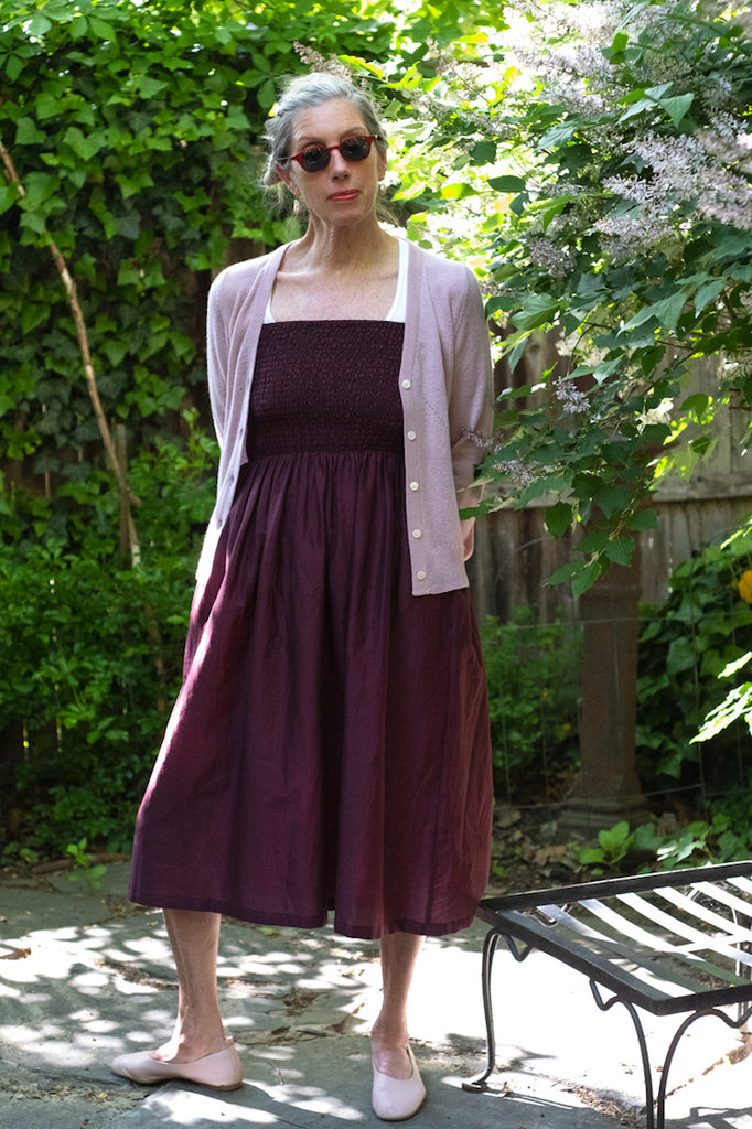 Susannah Thompson in the M.PATMOS Hester Dress in Mulberry and Grace Cashmere Cardigan in Lily