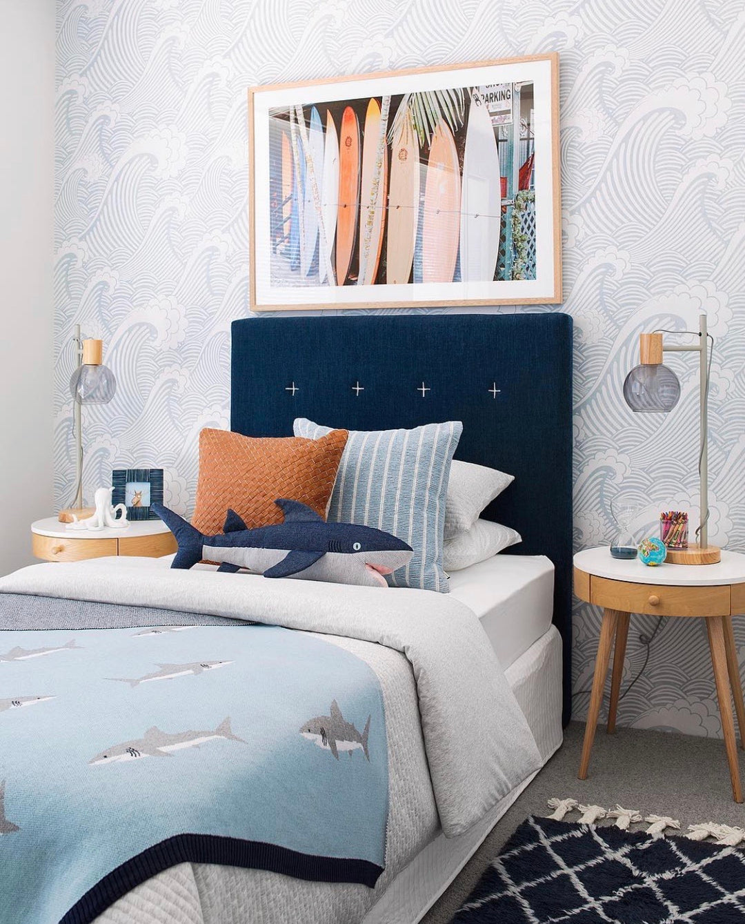 Sail Away wallpaper in a bedroom with nautical themed bedsheets