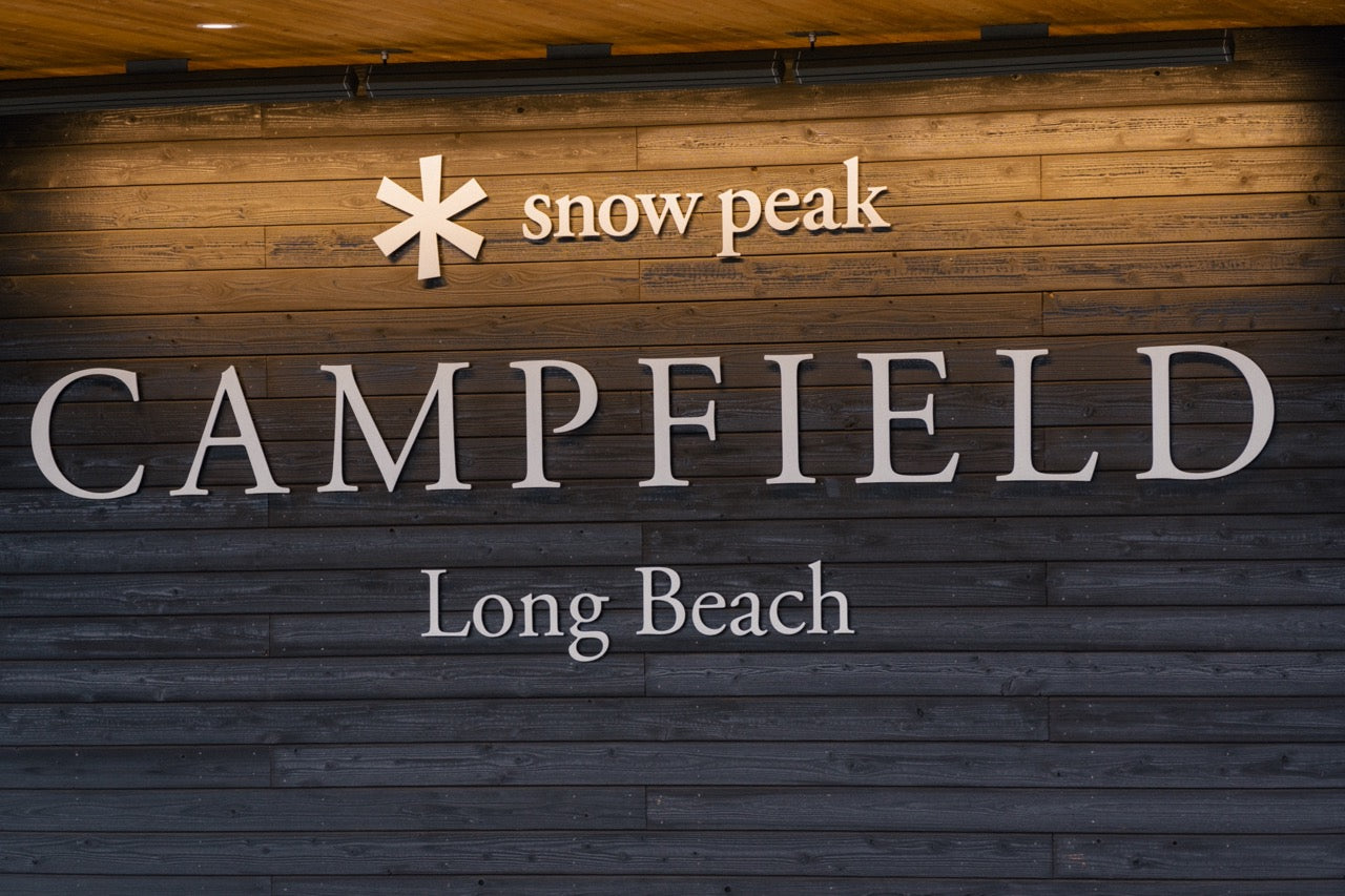 A sign that says Snow Peak Campfield Long Beach on the Gatehouse