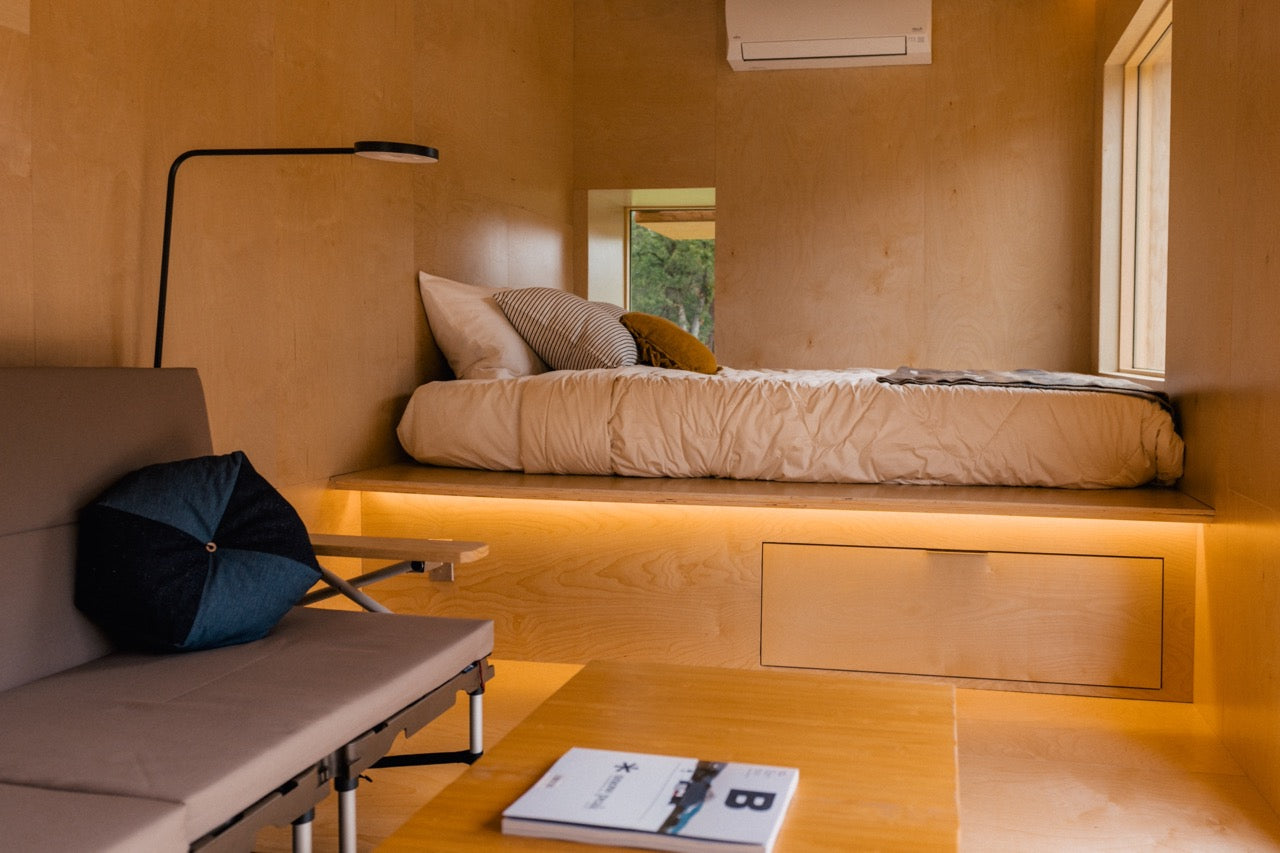 The interior of the Jyubako Suite, complete with a queen-sized bed, futon and coffee table.