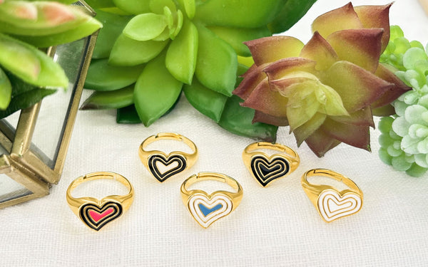 All 5 of the Gold Deco Heart Signet Rings with plants.