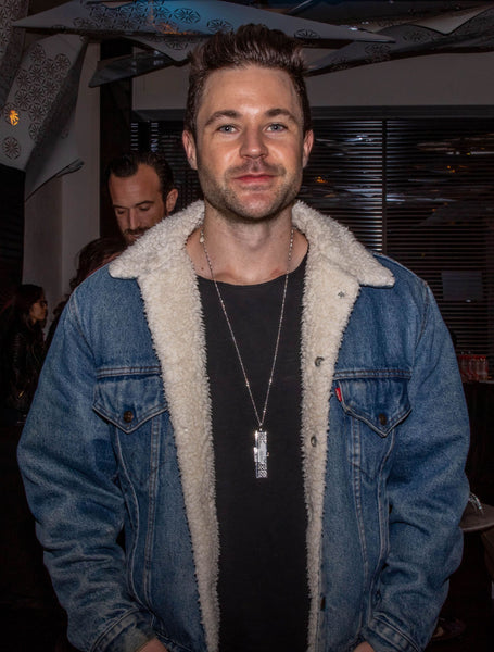 Brandon Stansell wearing a Fortune & Frame fortune locket