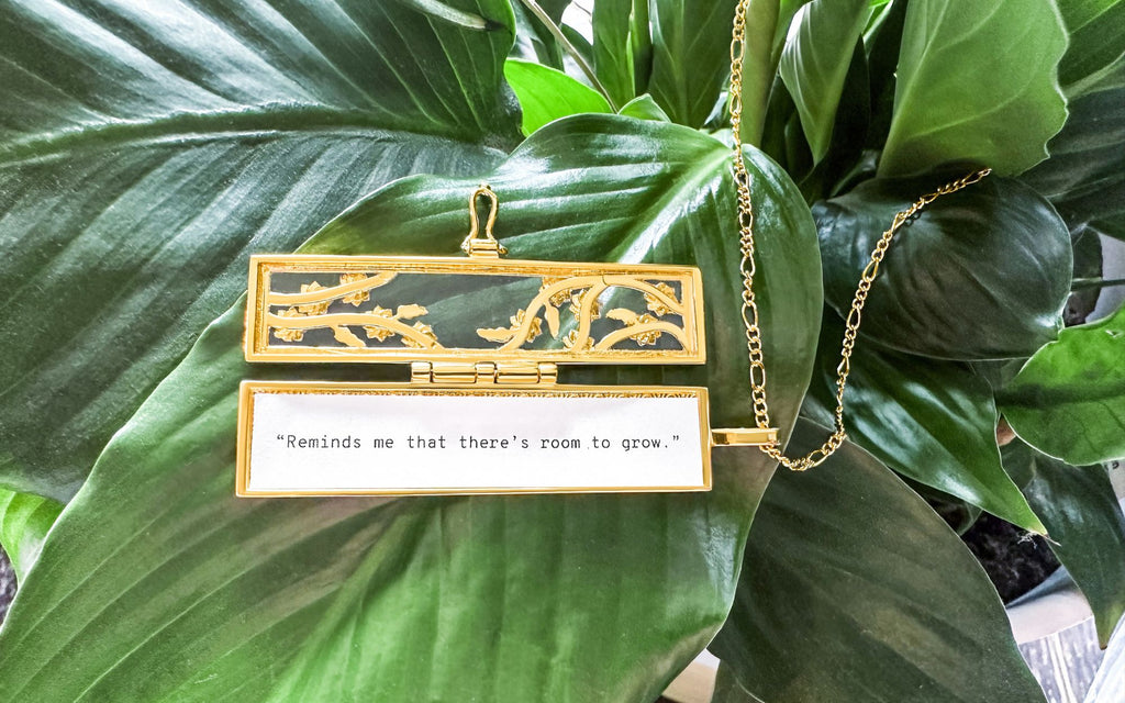 Flowered Vines Fortune Locket in a green plant with a fortune inside that reads "“Reminds me that there's room to grow.”