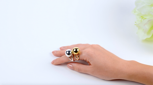 Shown here: Fortune & Frame Sphere Secret Rings, modern-day interpretations of poison jewelry.