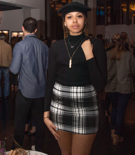 Victorie Franklin wearing a fortune locket from Fortune & Frame