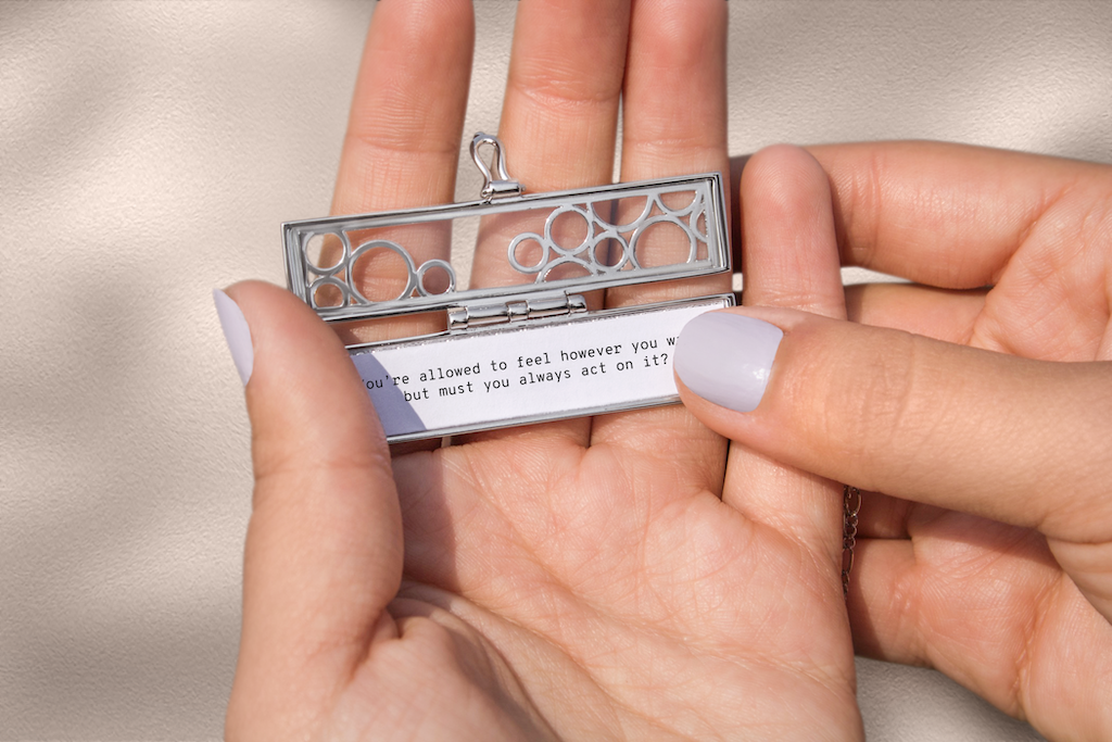 Wear your inspirational quotes for getting out of a bad mood in a locket