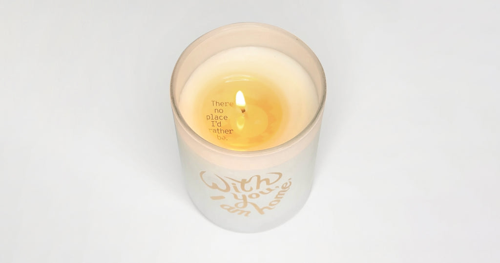 The "With You, I Am Home" Secret Fortune Candle burned to reveal the message inside.