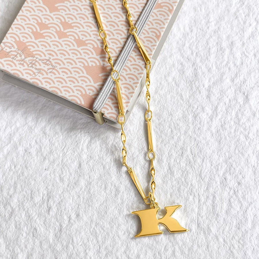 Elsa Peretti® Alphabet Letter K Pendant in Silver with Diamonds, Small |  Tiffany & Co.