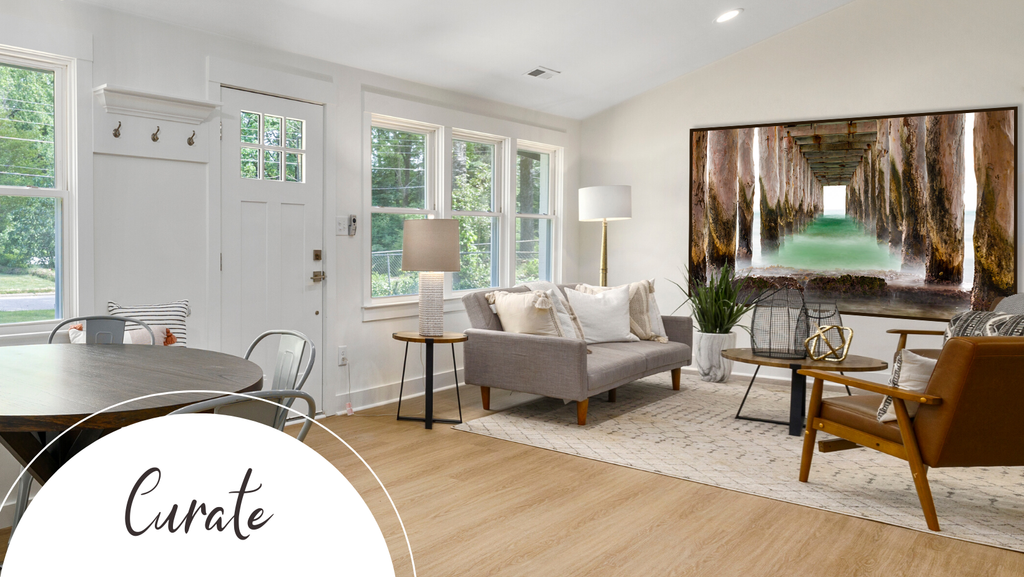 family room with large art on the wall with a view of underside of old worn wooden pier 