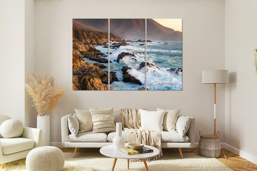 PCH Big Sure Coastline 3 piece canvas artwork on the wall over a beige sofa with soft beige accents.