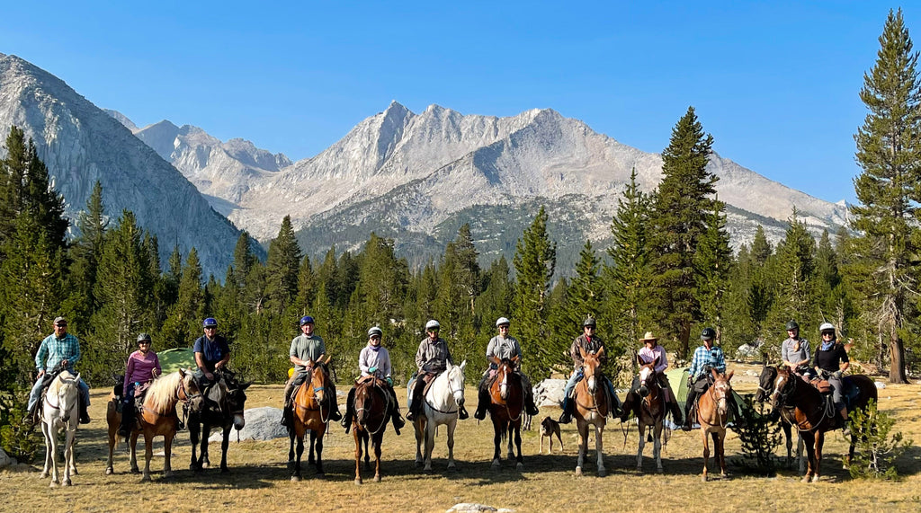 Group of photographers on horseback