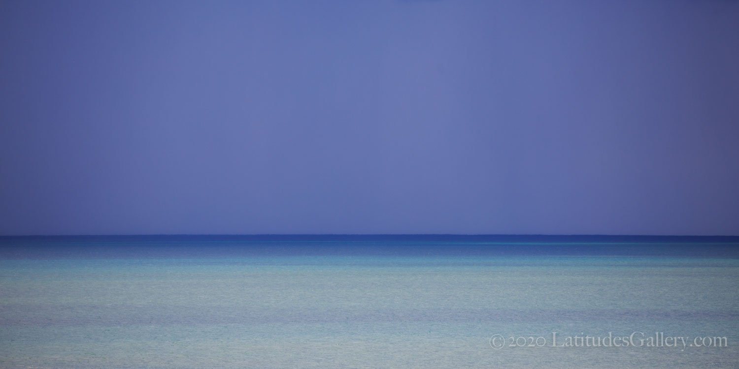 Seascape art of clear, shallow waters rippling lightly with the ocean breeze.