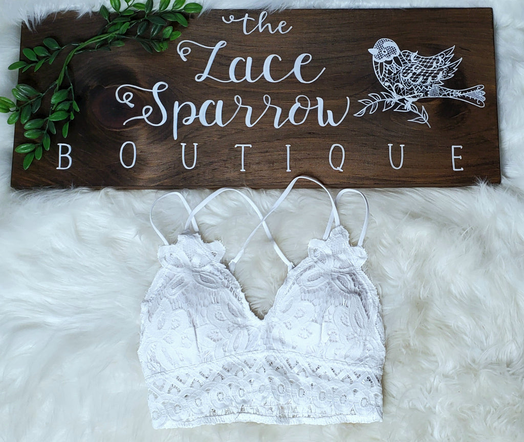 Semi sheer lace bralette featuring floral lace detailing and scalloped  trim. • V-Neckline • Spaghetti Straps w/ crisscross strappy front • Wide  Bottom Lace Band • Removable/Padded Cups • Closure Style: Pullover •