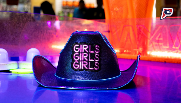 "Neon blue cowgirl hat with a 'Girls Girls Girls' patch centered, creating a bold and vibrant accessory statement."