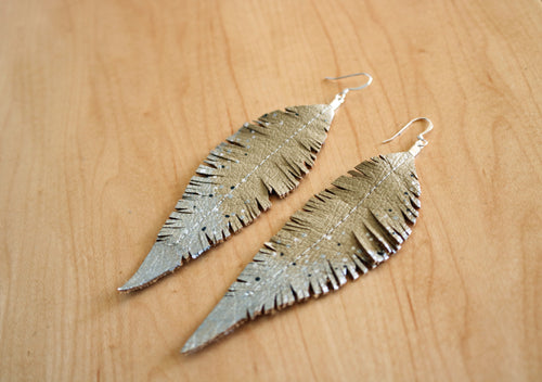 Silver feather earrings dangle metal feather textured 3.25