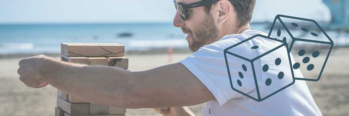 man playing with wooden blocks