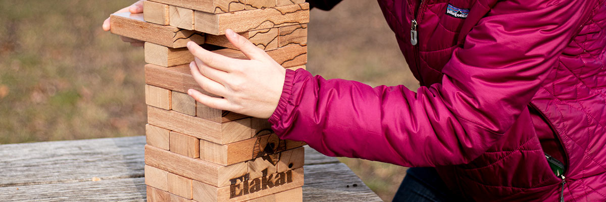 person playing giant mountain block game