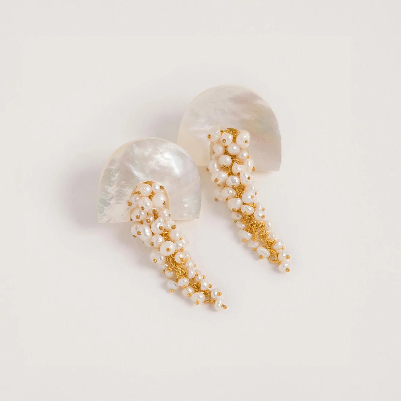 A product shot of 'Hakuro Midi Gold' A gold mother of pearl and seed pearl drop earring  - Freya Rose Jewellery