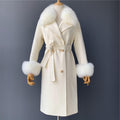 An off white cashmere coat trimmed with fox fur collar and fur cuffs called "London" designed by MVFURS.